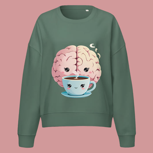 “A green sweatshirt with a cute pastel cartoon brain hugging a smiling coffee cup, both with kawaii faces, perfect for cozy self-care or study time.”